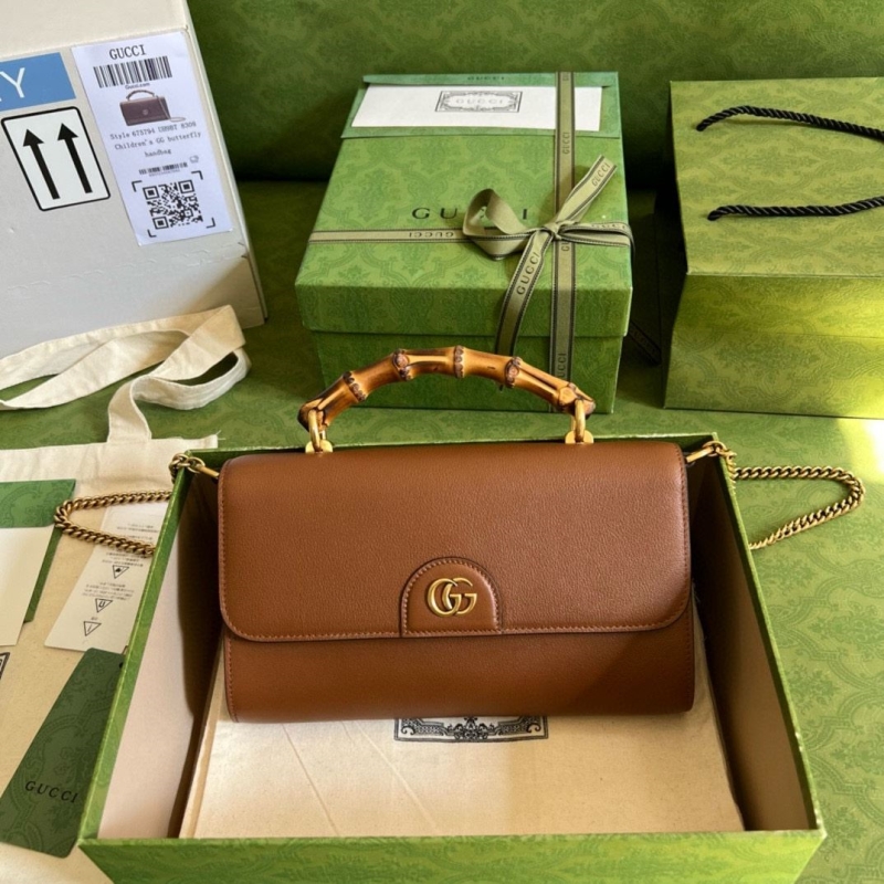 G*u*i top handle bags